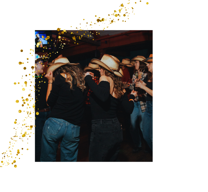 Friends celebrating with champagne and sparklers at a private event